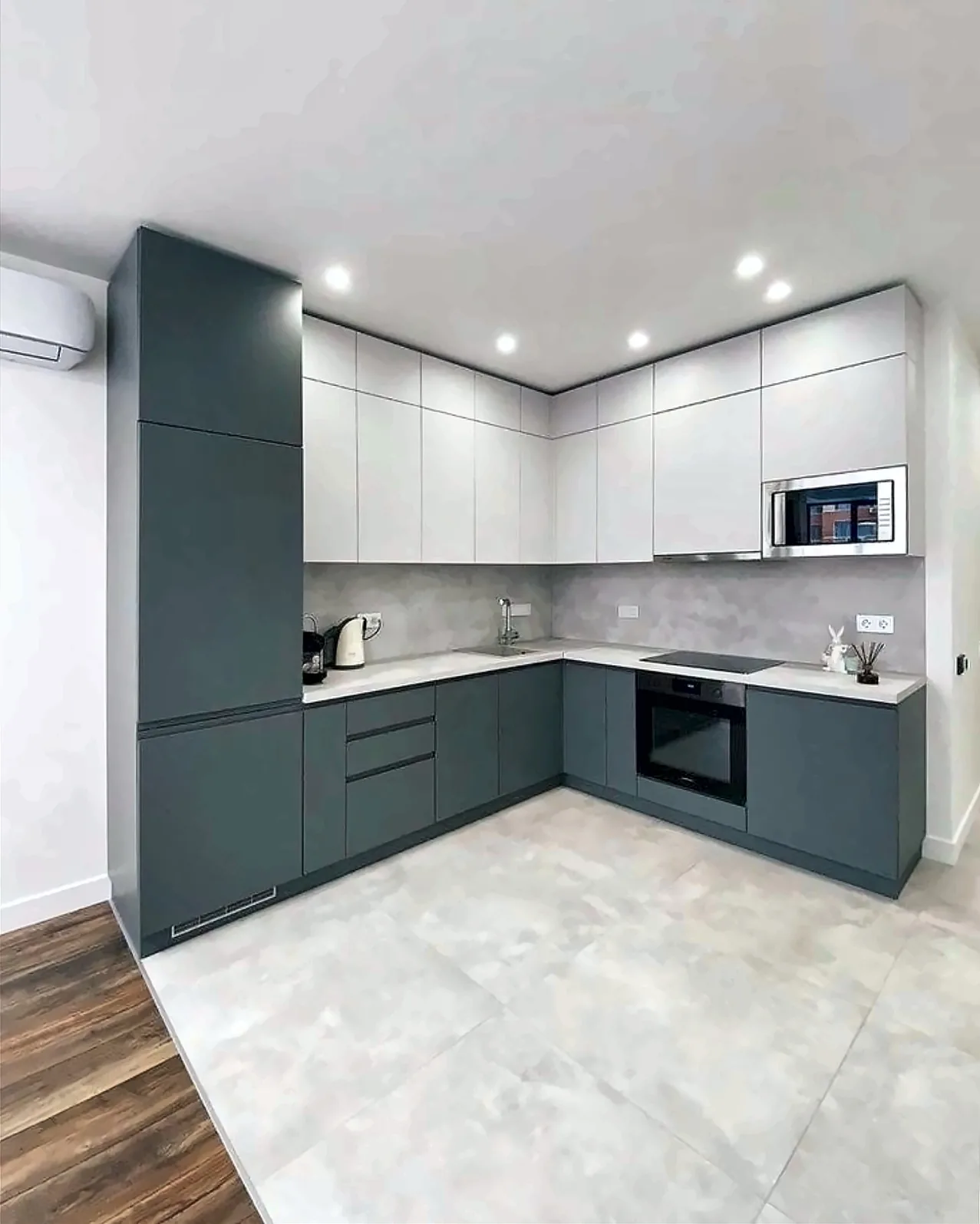 Completed Yadani L-shaped kitchen with slate-grey handleless base units